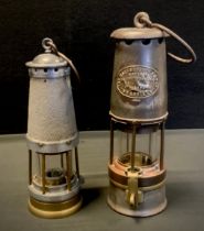 A Wolf Patterson Miner’s Safety Lamp No. 7R, 29cm high; another, Deco Ltd., safety lamp, (2).