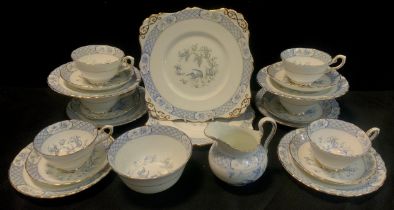 A Tuscan China tea set for six, decorated blue birds with lattice border including two picnic