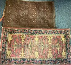 A Middle Eastern woollen rug or carpet, stylised motifs in shades of red, blue and ochre, 183cm x
