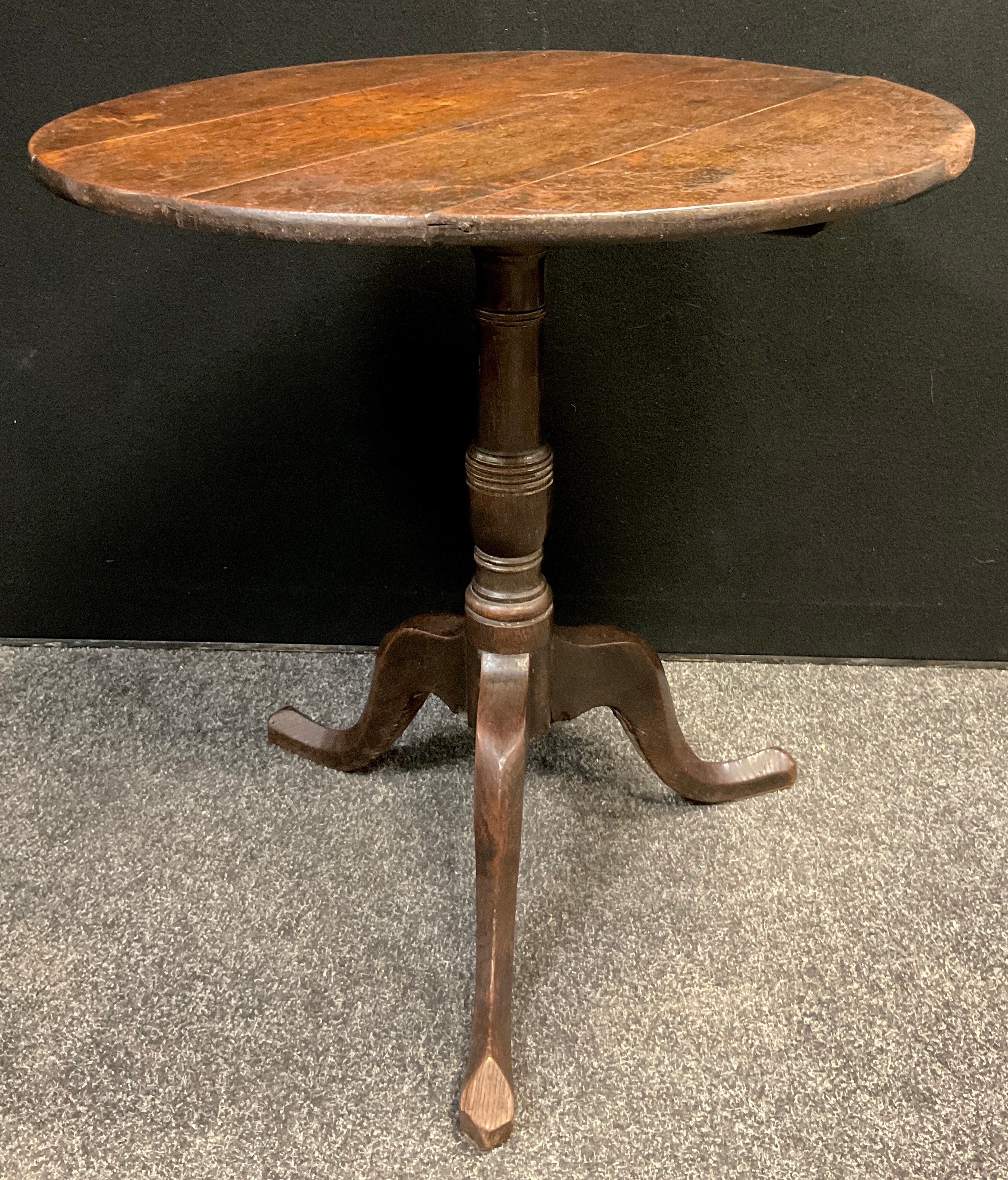 A George III oak tripod occasional table, 71cm high x 71.5cm diameter.