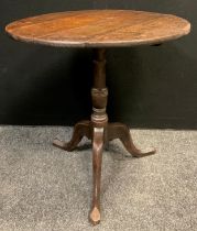 A George III oak tripod occasional table, 71cm high x 71.5cm diameter.
