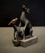 A Chinese patinated bronze desk seal, in the form of 2 interlocking deer, height 11.5cm