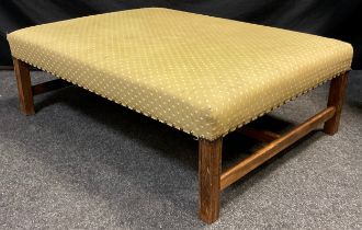 A large upholstered footstool, stained beechwood frame, 36cm high x 103cm x 76cm.