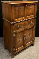 A Jaycee furniture oak cocktail cabinet, 124cm high x 74.5cm wide x 42.5cm deep.