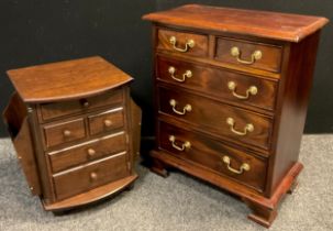 A George III style chest of drawers, of small proportions, two short, over three graduated long