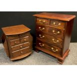 A George III style chest of drawers, of small proportions, two short, over three graduated long