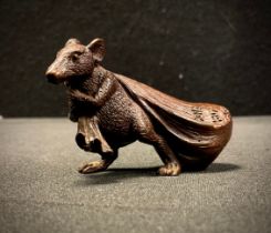 A small Japanese bronzed metal figure, as a Rat with Swag Bag, 6cm high
