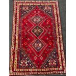 A South West Persian Qashga’i rug / carpet, knotted with traditional stylised figures and abstract