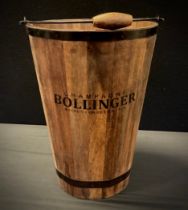 A metal banded wooden bucket, marked Champagne Bollinger, Maison Fondee En 1829, 30cm diameter, 41cm