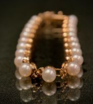 A 9ct gold cultured pearl and floral link bracelet, stamped 375, 10k, Qvc, 8.2g gross