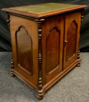 A Victorian mahogany side cabinet, over-sailing rectangular top with green leather writing