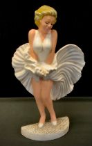 A painted cast iron doorstop, as Marilyn Monroe, 34cm high.