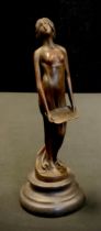 An Art Nouveau style bronzed metal figure, scantily clad maiden holding a board, 18.5cm high.