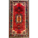 A North West Persian Nahawand rug / carpet, in rich colours, red, green, blue, and cream, 230cm x