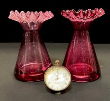 A glass ball magnification desk clock, 6cm diam, 6.5cm high over loop, pair of cranberry glass vases