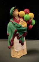 A Royal Doulton figure, 'The Balloon Seller' HN 583,4-7-29, printed and impressed marks, 22cm high