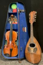 Musical instruments - a 3/4 size student’s violin, cased; and a mid 20th century Mandolin, bone
