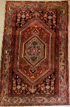 A Middle Eastern Qashga’i style rug / carpet, knotted with central hexagonal-form medallion,