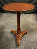 A 19th century mahogany pedestal wine table, 74.5cm high x 46cm diameter.