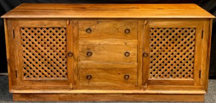 An Contemporary exotic hardwood sideboard, over-sailing top, above three central drawers, flanked by