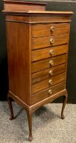 An Edwardian mahogany music cabinet, quarter galleried back, seven drawers, 118cm high x 50cm wide x