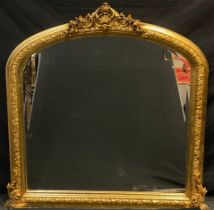 A large gilt framed over mantle wall mirror, ornate arched top, approx 131cm x 125cm