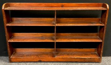 An early 20th century pitch pine open bookcase, 90.5cm high x 139.5cm wide x 16.5cm deep.