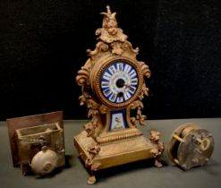 A 19th century French gilt metal and porcelain mounted mantel clock, c.1870; two clock movements (3)
