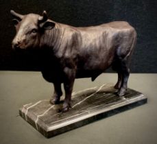 A bronzed metal animalier model as a Bull. black marble plinth base, 17cm high, 24.5cm long.