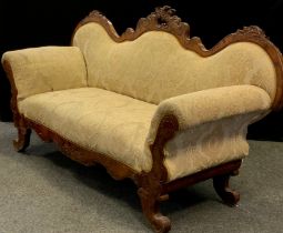 A Victorian Louis XV revival walnut sofa, serpentine-shaped back, rococo carved c-scrolls and