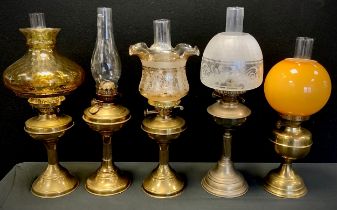 A Victorian brass oil/paraffin lamp, frosted etch glass shade, others amber glass, etc.(5)