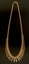 A 9ct gold fringe necklace, tapering front section, 42cm long, 11g