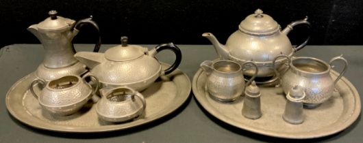 Pewter - A planished pewter Craftsman Sheffield three piece tea set on tray; another (2)