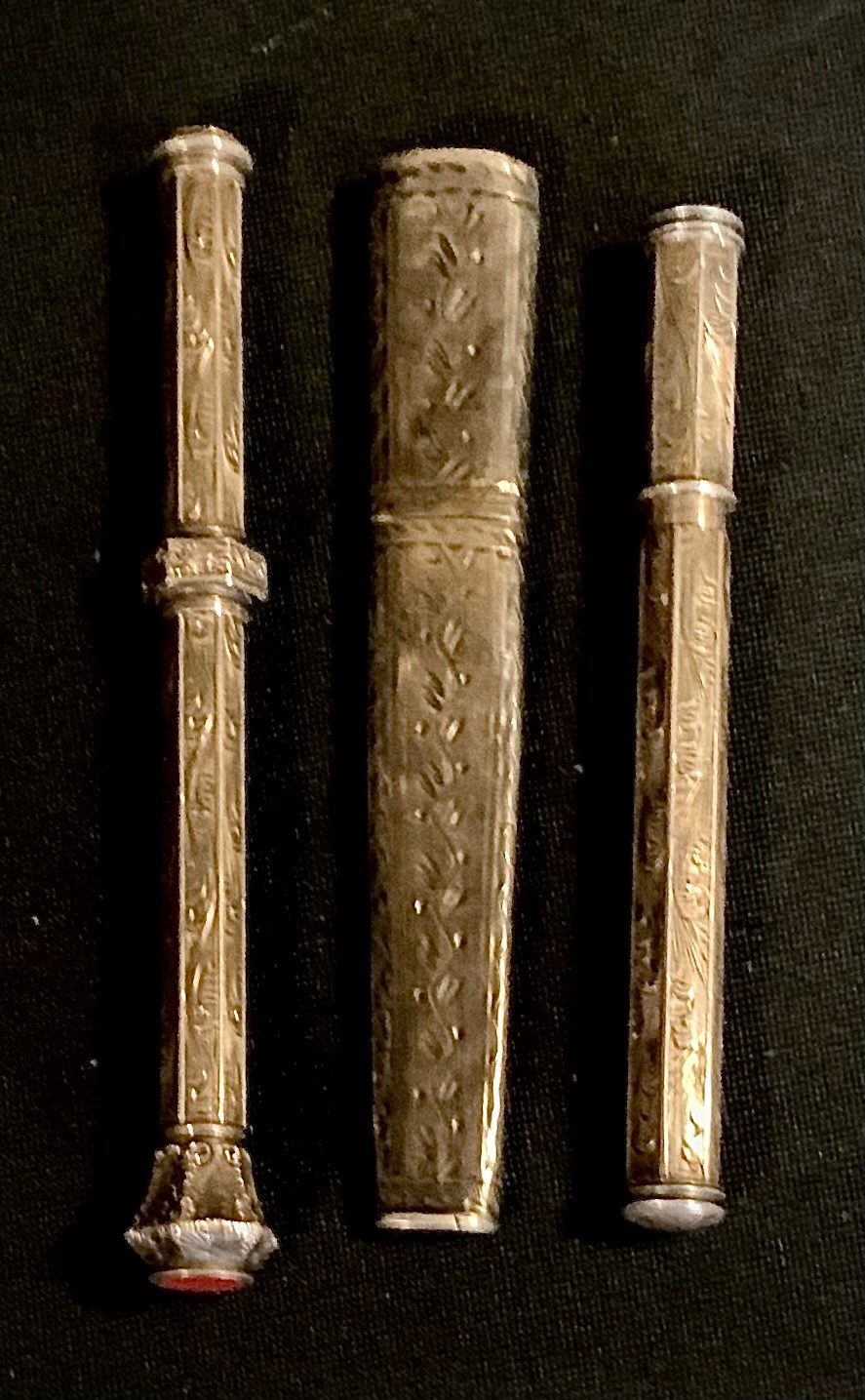 A 19th century silver coloured metal propelling pencil, carnelian terminal; a pencil lead case,