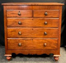 A Victorian mahogany chest of drawers, over-sailing rounded rectangular top, over two short and