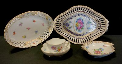 A Dresden shaped oval basket, decorated with pink, yellow and white flowers and roses, within gilt