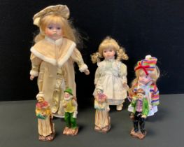 Three collectors dolls; four continental figurines.