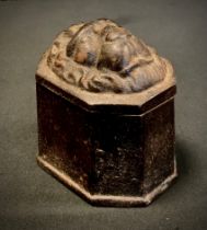 A cast iron lion head snuff box, cm long