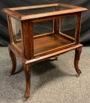 A four glass Vitrine/Bijouterie cabinet, glazed top, fall front, carved frieze, cabriole legs,