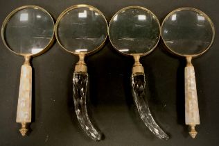 A pair of mother of pearl handled magnifying glasses, another pair cut glass (4)