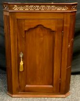 A 19th century mahogany corner cupboard, pierced pediment, single door with shaped panel, 96.5cm