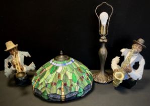 A Tiffany style lamp, leaded shade decorated green shade with a border of dragonflies, 60cm high ; a