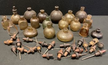 Glass hand grenade bottles, mostly spherical, some flat sided, part spherical bottles, various