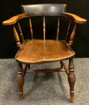 A 19th century elm Windsor back smoker's bow desk armchair, maker's stamp CR, c.1850