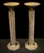 A pair of classical style beige marble columns, with octagonal tops, reeded columns, 101cm high x