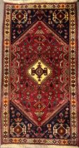 A South West Persian Qashga’i rug / carpet, knotted with a central diamond-shaped medallion,