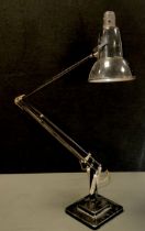 A Herbert Terry & Son Ltd angle poise desk lamp, black finish, shaped shade, approx 86cm long.