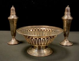 A silver pedestal bonbon dish, Walker & Hall, 4.40zt; pair of weighted sterling silver pepper and