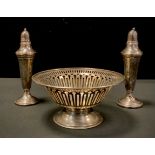A silver pedestal bonbon dish, Walker & Hall, 4.40zt; pair of weighted sterling silver pepper and