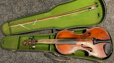 A full size violin, the peg-box scroll carved as the head of a lion, in the style of Jacobus